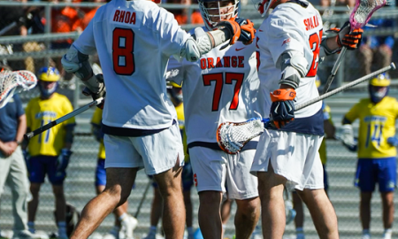 Syracuse Men's Lacrosse players celebrate after a goal against Delaware
